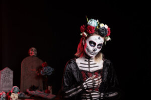 Creepy goddess of death with festival make up and halloween costume